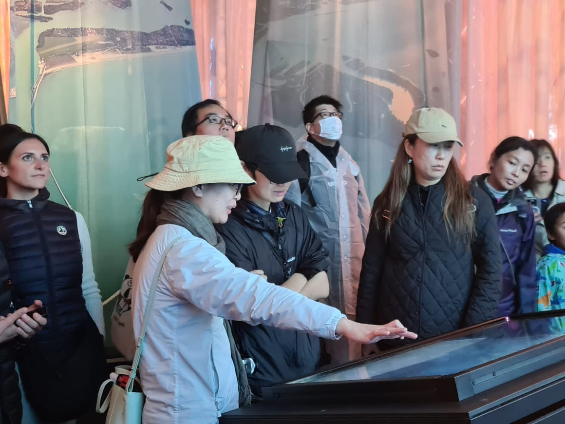 visitors interacting with the touch screen